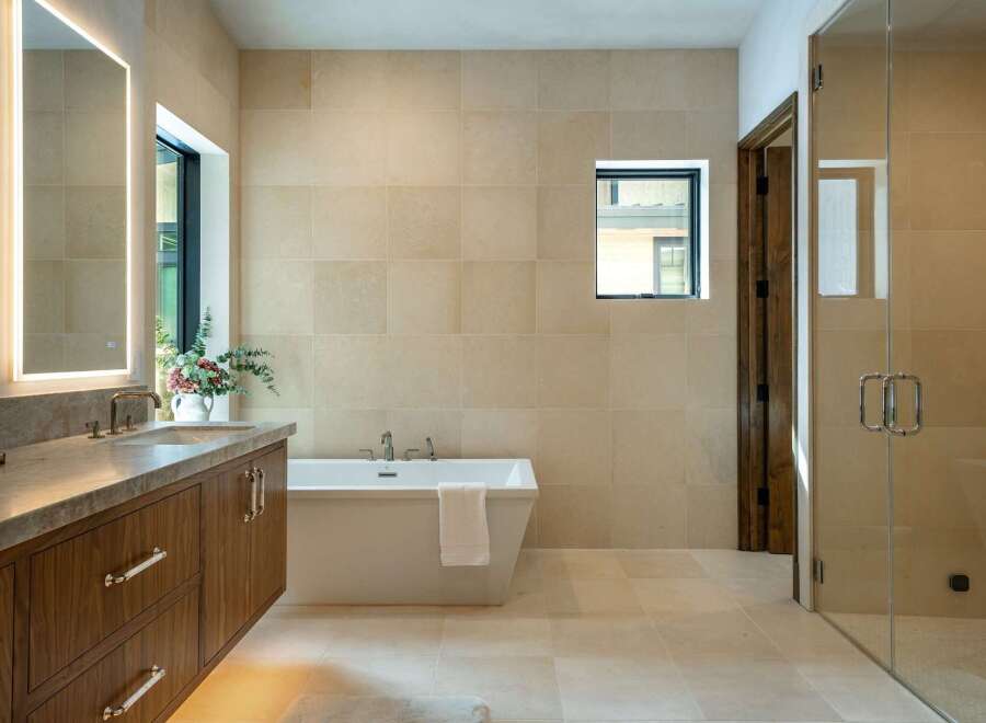 Step into luxury with this stunning bathroom featuring a modern design and high-end finishes.