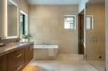 Step into luxury with this stunning bathroom featuring a modern design and high-end finishes.