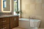 Step into luxury with this stunning bathroom featuring a sleek, modern design.