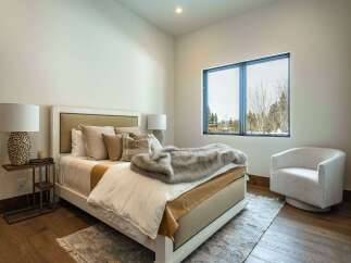 Step into this serene bedroom, showcasing a blend of modern design and natural elements.
