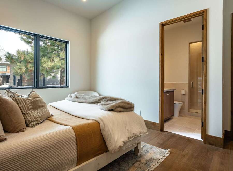 Step into this inviting bedroom, featuring a cozy bed and a serene atmosphere.