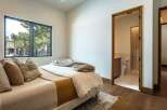 Step into this inviting bedroom, featuring a cozy bed and a serene atmosphere.
