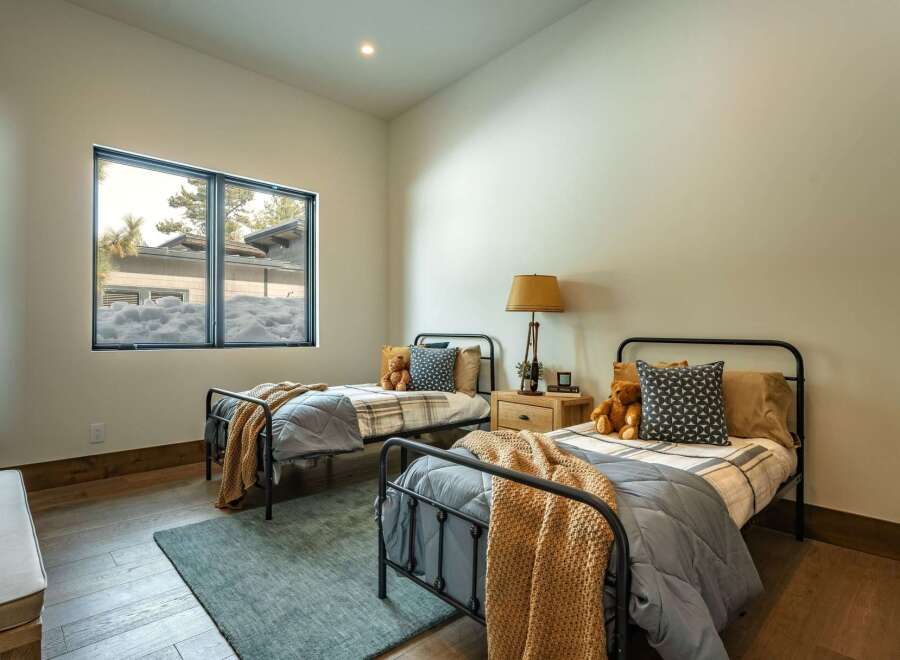 This cozy bedroom features two twin beds, perfect for a guest room or children's space.