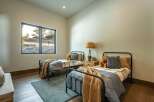 This cozy bedroom features two twin beds, perfect for a guest room or children's space.