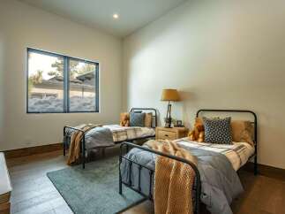 This cozy bedroom features two twin beds, perfect for a guest room or children's space.