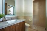 This stunning bathroom boasts a modern design with a sleek vanity and a spacious walk-in shower.