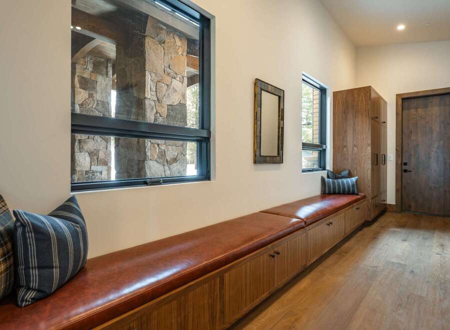 This stunning entryway showcases a blend of rustic and modern design elements.