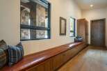 This stunning entryway showcases a blend of rustic and modern design elements.