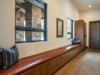This stunning entryway showcases a blend of rustic and modern design elements.