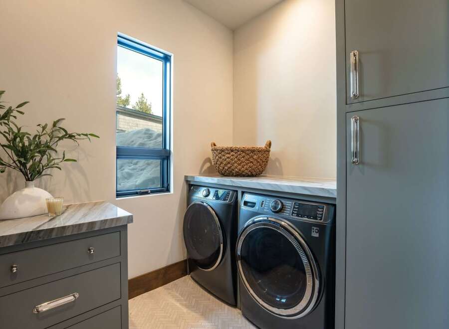 Discover the epitome of modern living in this stunning property, featuring a beautifully designed laundry room.