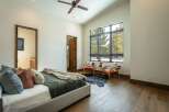 This stunning bedroom boasts a modern design with a touch of rustic charm.