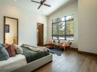 This stunning bedroom boasts a modern design with a touch of rustic charm.