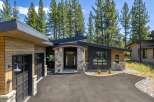 Discover modern mountain living in this stunning home, featuring a striking architectural design with natural wood siding and stone accents.