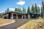 Discover modern luxury in this stunning home featuring a striking architectural design with natural wood and stone accents.
