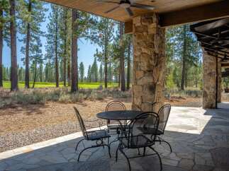 Enjoy outdoor living on this expansive covered patio, perfect for al fresco dining or relaxing with a view.