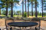 Enjoy your morning coffee or evening drink on this charming patio, complete with a wrought iron table and chairs.