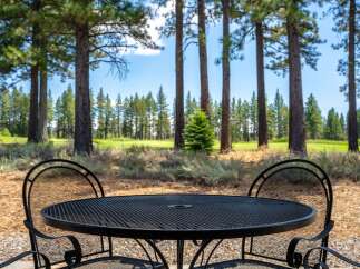 Enjoy your morning coffee or evening drink on this charming patio, complete with a wrought iron table and chairs.