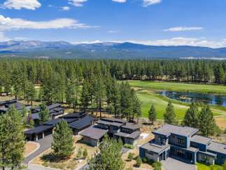 Experience luxury living in this modern architectural masterpiece, nestled amidst a serene golf course and surrounded by a lush pine forest.
