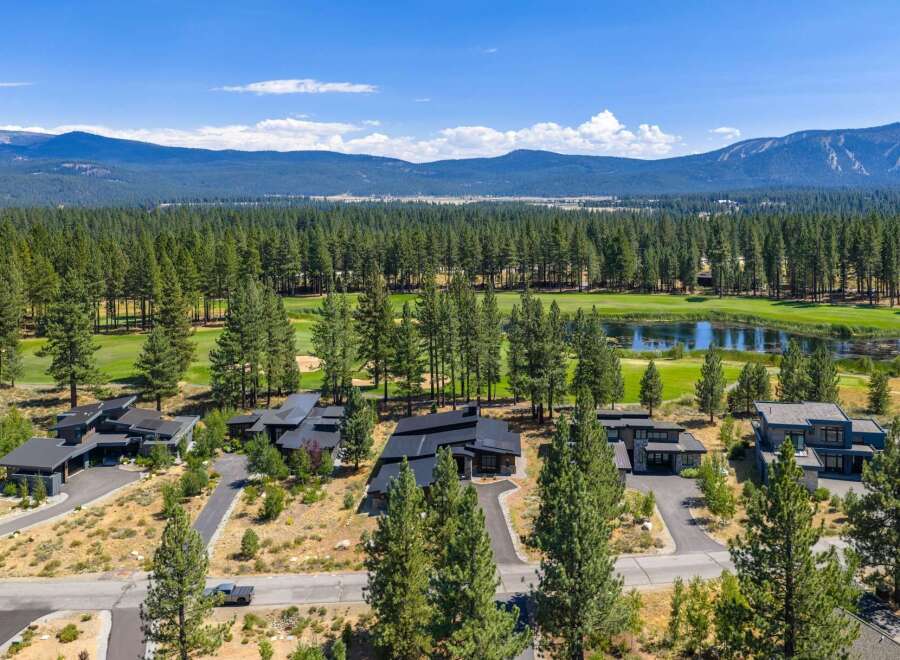 Experience luxury living in this modern architectural masterpiece nestled beside a pristine golf course and tranquil lake.
