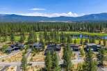Experience luxury living in this modern architectural masterpiece nestled beside a pristine golf course and tranquil lake.