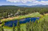 Experience luxury living amidst a stunning golf course setting, featuring a serene lake and lush green fairways.
