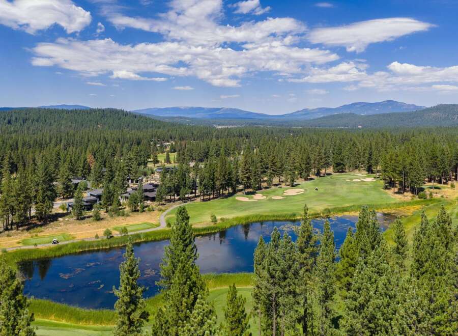 Experience luxury living amidst a stunning golf course and serene lake.