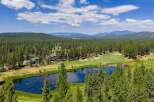 Experience luxury living amidst a stunning golf course and serene lake.