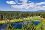 Experience luxury living amidst a stunning golf course setting with this aerial view.