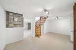 Discover the charm of this unique property featuring a stunning wooden spiral staircase.