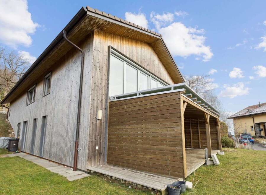 This stunning wooden house offers a unique blend of modern design and natural elements.