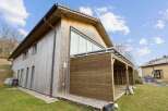 This stunning wooden house offers a unique blend of modern design and natural elements.