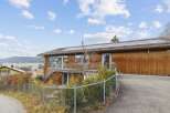 Discover this stunning property featuring a modern design and a warm wooden exterior.