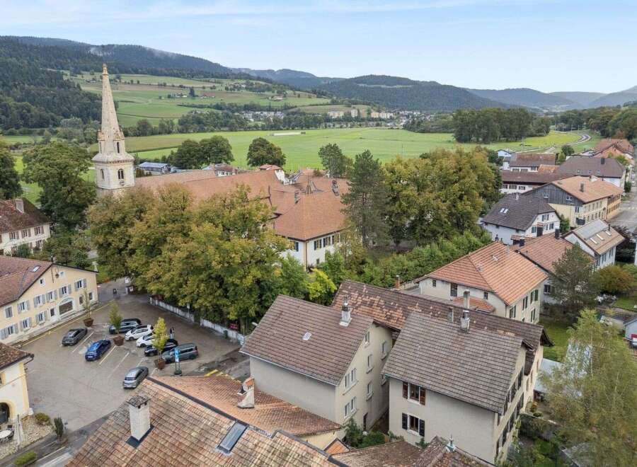 Discover the charm of this picturesque property nestled in a serene, green landscape.