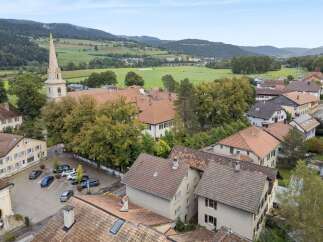 Discover the charm of this picturesque property nestled in a serene, green landscape.