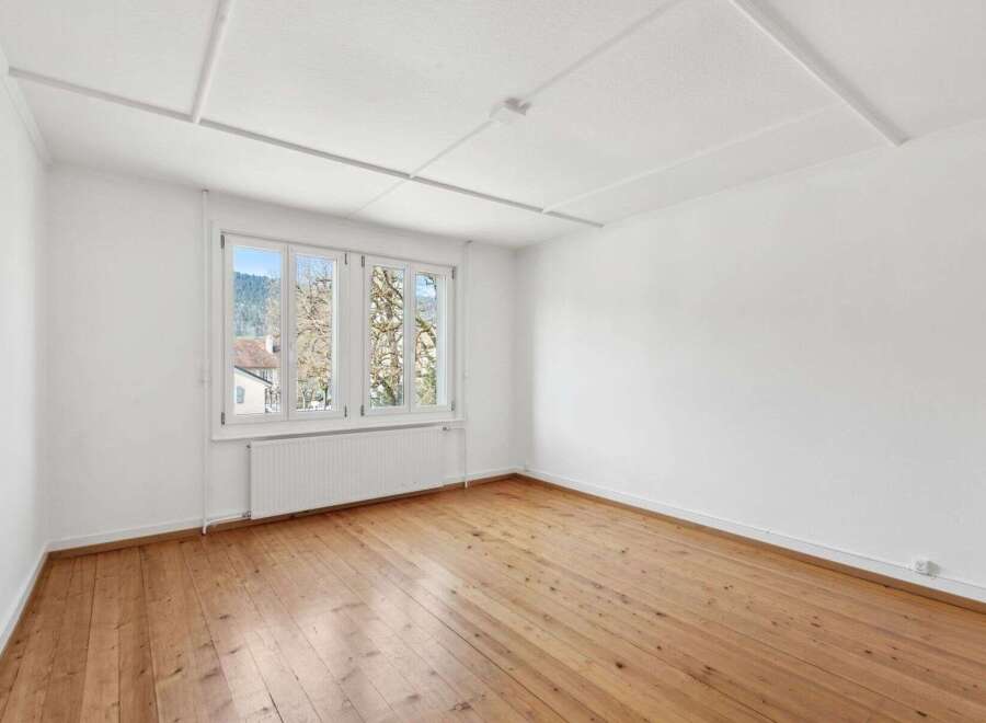 Discover the charm of this bright and airy room, featuring beautiful hardwood floors that add warmth and character.