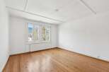 Discover the charm of this bright and airy room, featuring beautiful hardwood floors that add warmth and character.