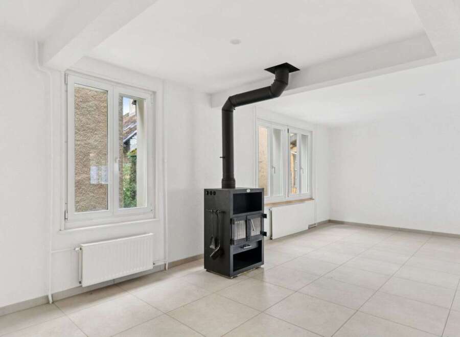 Discover the charm of this inviting property, featuring a cozy fireplace and ample natural light.