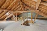 Discover the potential of this spacious attic, perfect for renovation or creative projects.