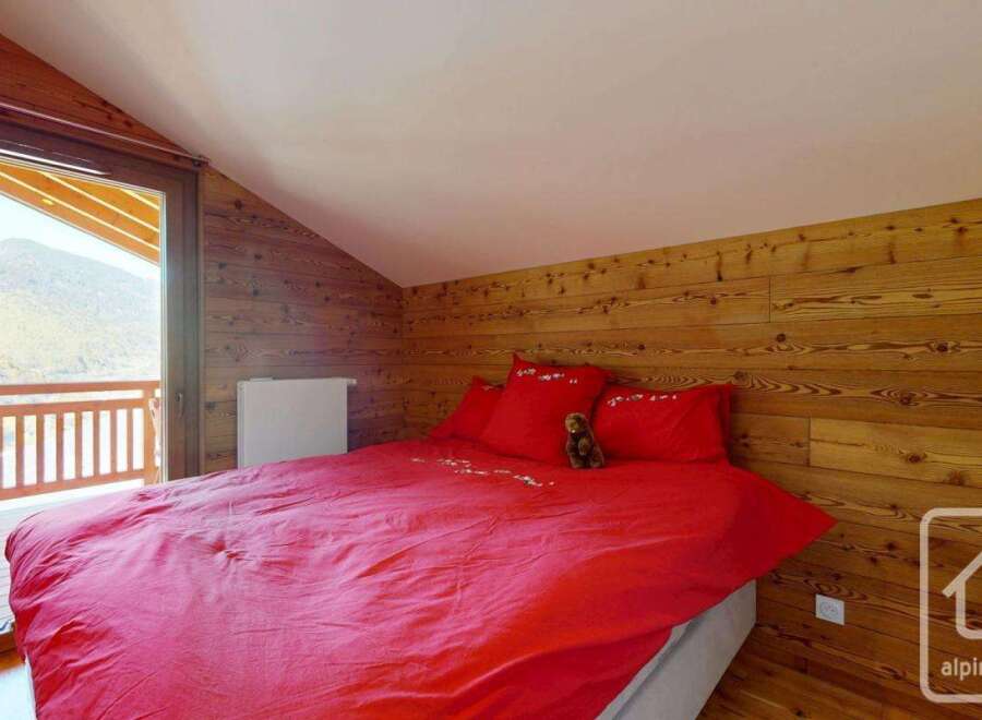Experience the charm of this cozy bedroom featuring a stunning view.