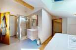 Discover this charming property featuring a well-appointed bathroom with a modern shower and vanity.