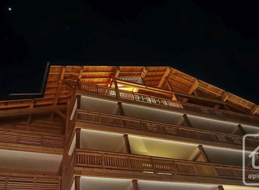 Experience luxury living in this stunning property, showcasing exquisite wooden architecture and design.