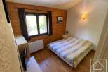 Discover this charming bedroom featuring a cozy bed, perfect for relaxation.