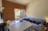 Discover this charming property featuring a cozy living space with a comfortable sofa and stylish decor.