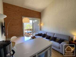 Discover this charming property featuring a cozy living space with a comfortable sofa and stylish decor.