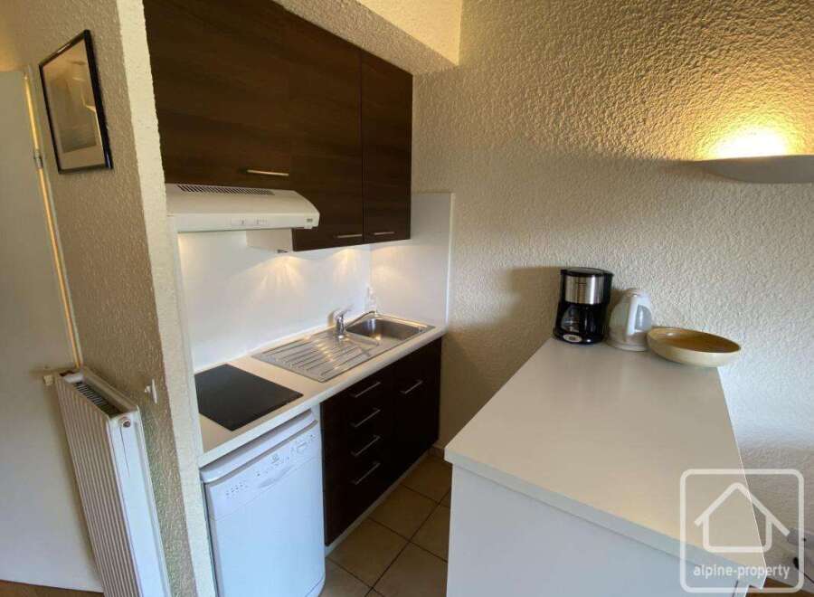 Discover this charming property featuring a well-equipped kitchen, perfect for preparing meals.