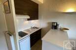 Discover this charming property featuring a well-equipped kitchen, perfect for preparing meals.