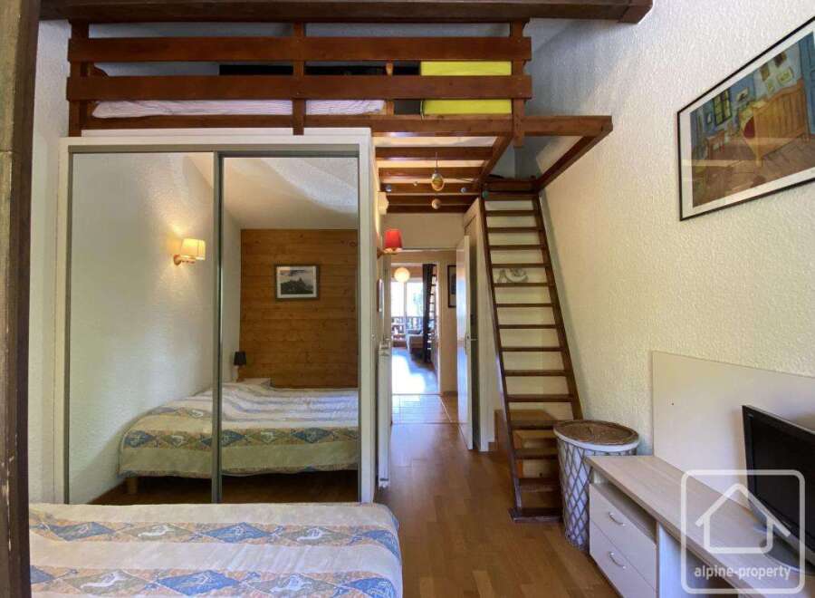 Discover this charming property featuring a cozy bedroom with a loft area, perfect for maximizing space.