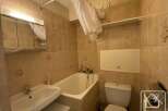 Discover this charming bathroom featuring a bathtub, sink, and toilet.