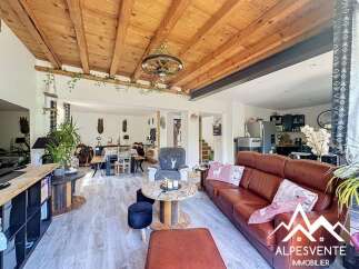 Discover the charm of this stunning property, featuring a beautifully designed living space with a rustic wooden ceiling and elegant flooring.
