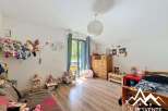 Discover a charming children's room filled with natural light and playful decor.